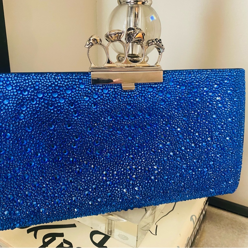 Alexander McQueen Blue. Skull Four Ring Embellished Clutch Bag